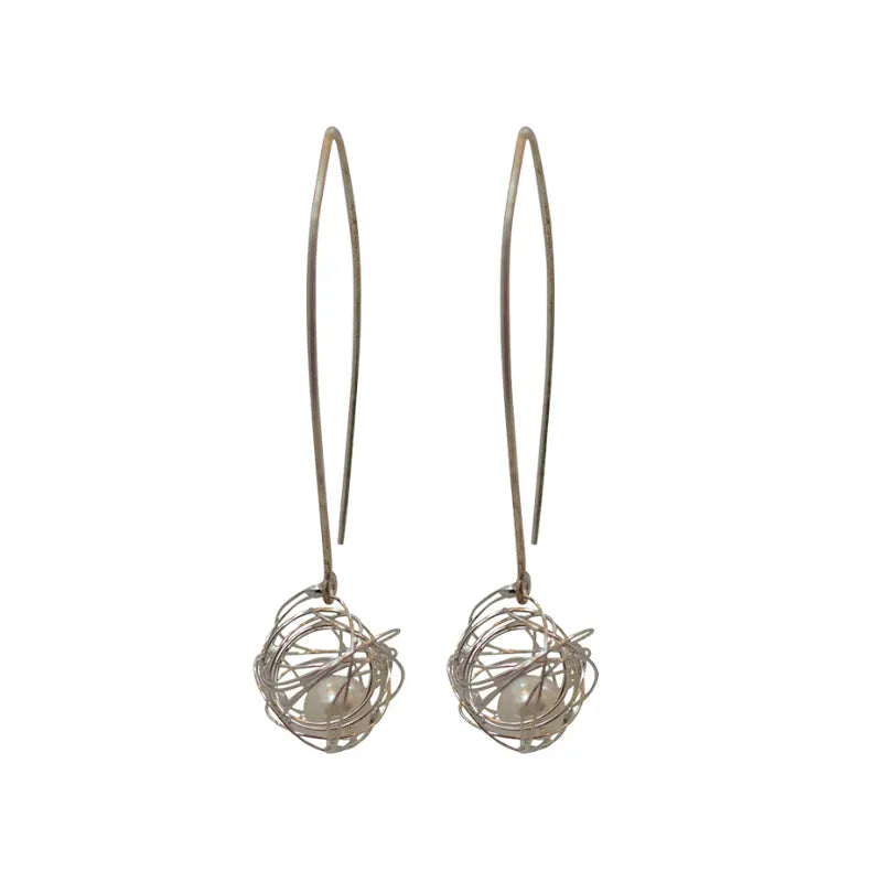 Pair of silver wire ball earrings on a white background
