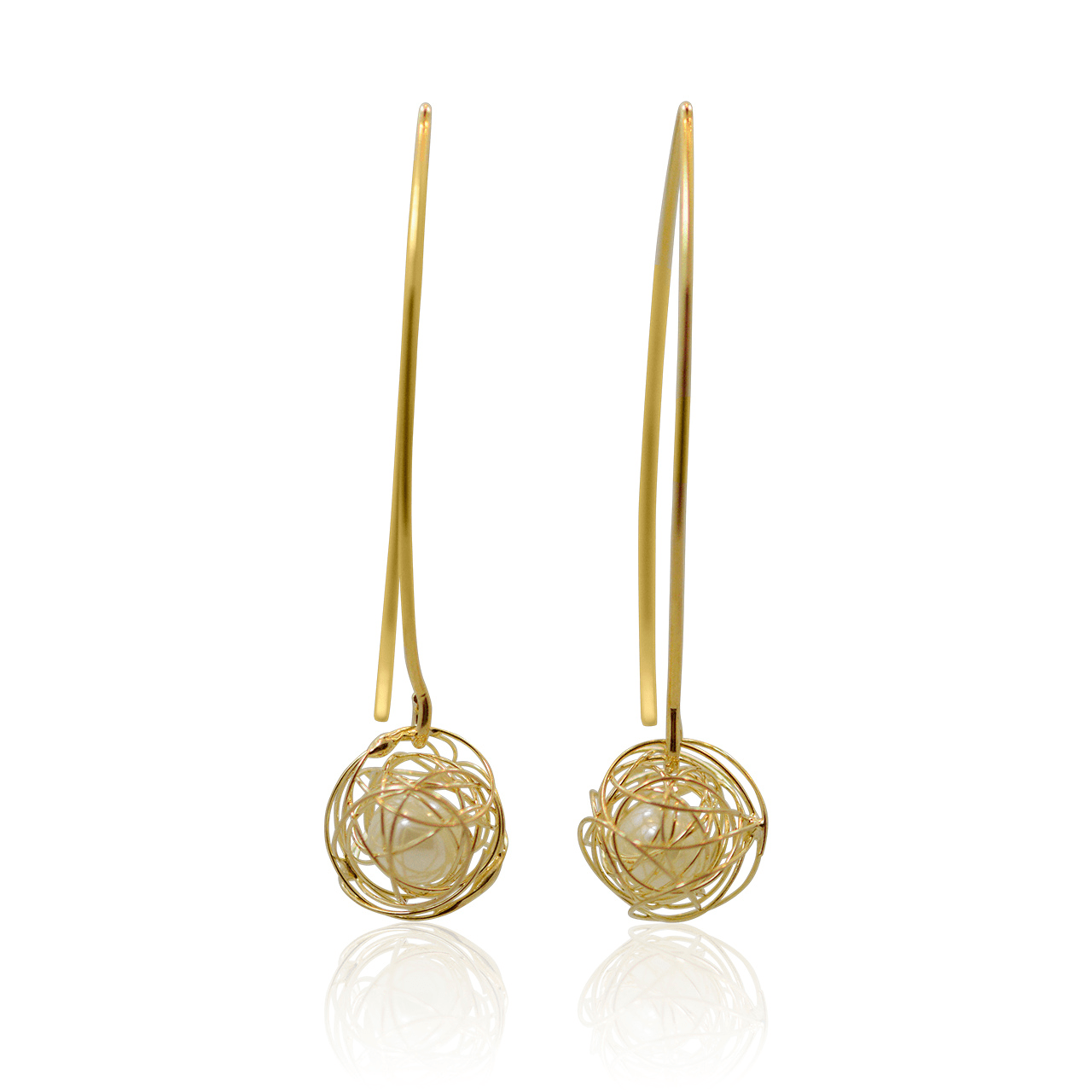 Pair of gold earrings with intricate designs on a white background