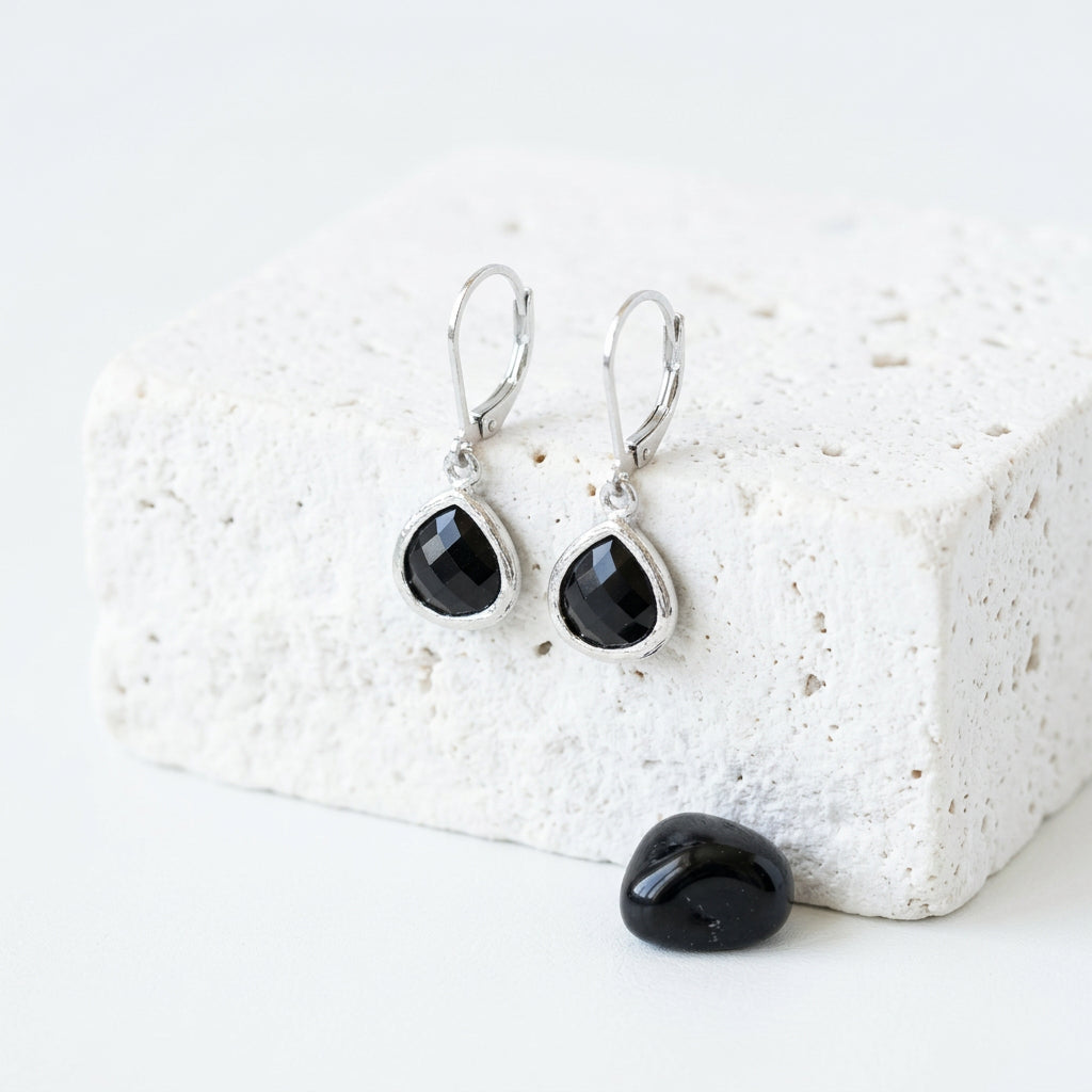 Silver Petite Pebble leverback earrings in black faceted glass