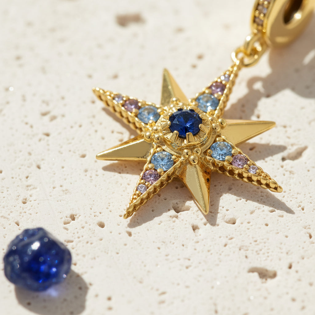 Close-up of blue cubic zirconia stones on a gold-plated sterling silver star charm