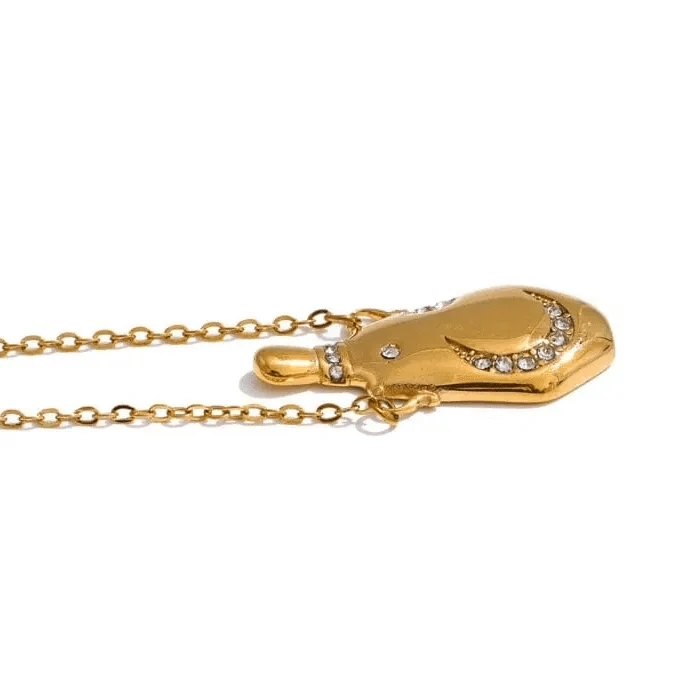 Gold necklace with a pendant on a white background