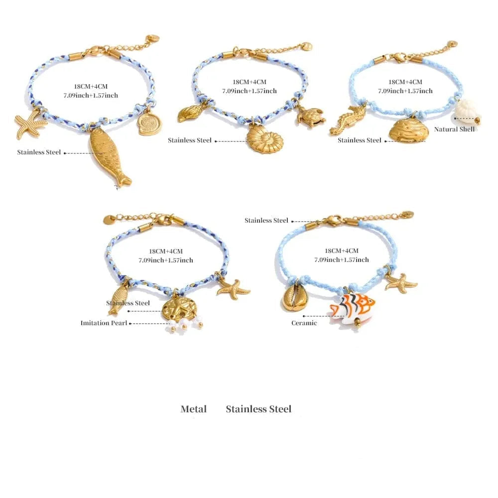 Set of five blue beaded bracelets with various charms on a white background