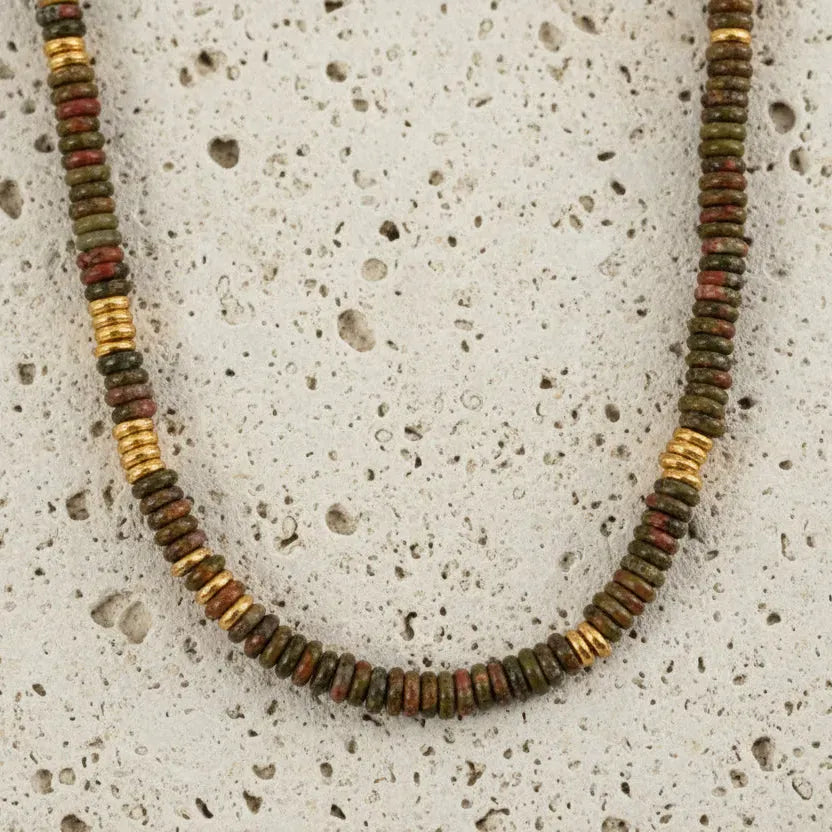 Necklace with multicolored beads on a white background