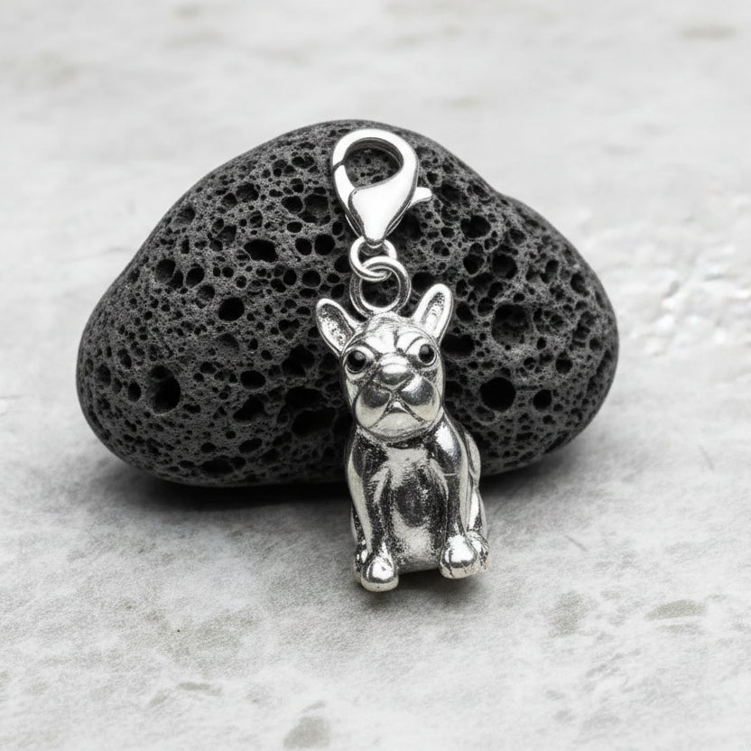 Silver rabbit pendant on a textured gray background