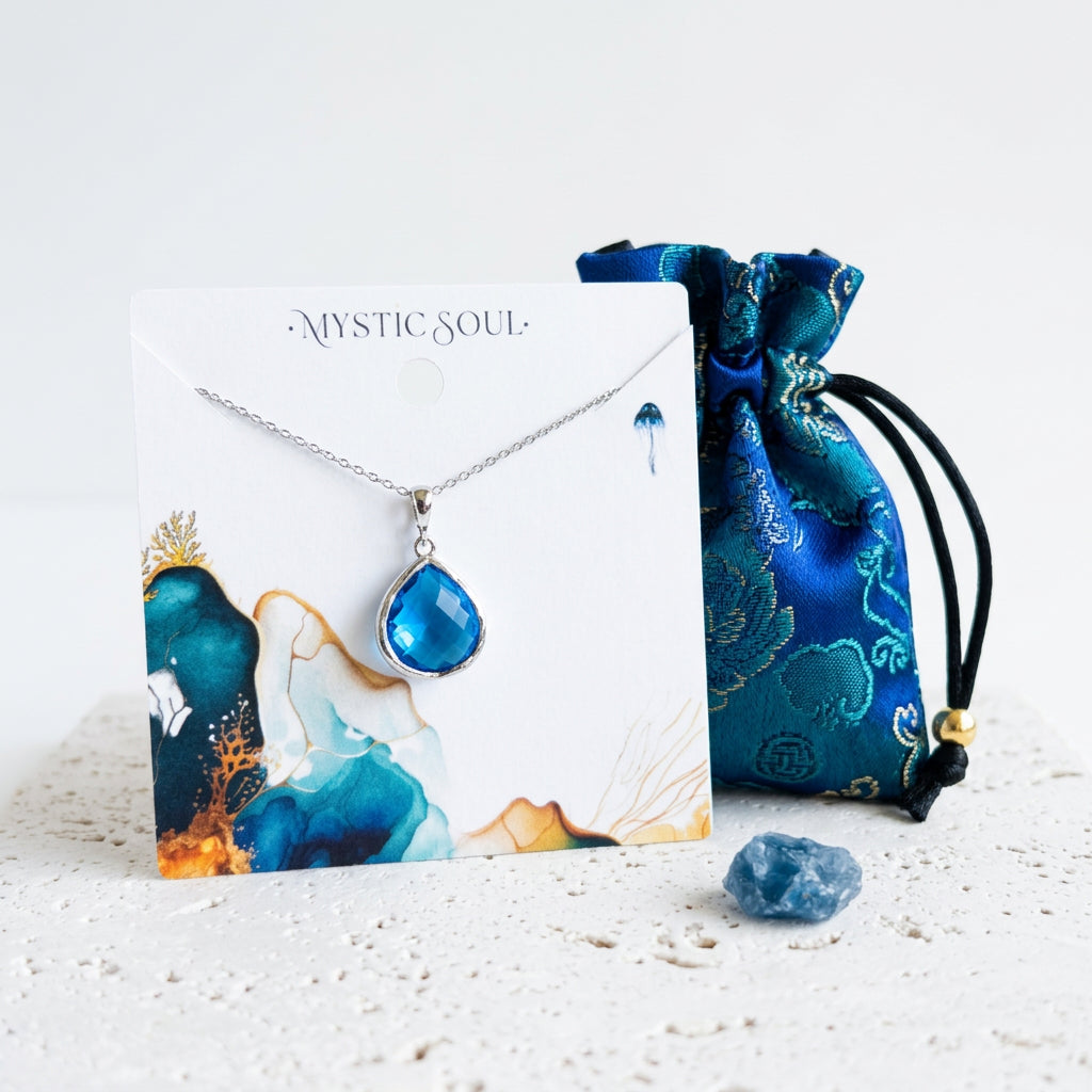 Silver Capri blue faceted glass Elegant Pebble necklace with Mystic Soul gift tag and satin pouch