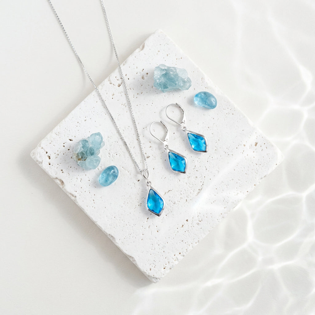 Silver Selene necklace and matching drop earrings with framed Capri blue faceted glass