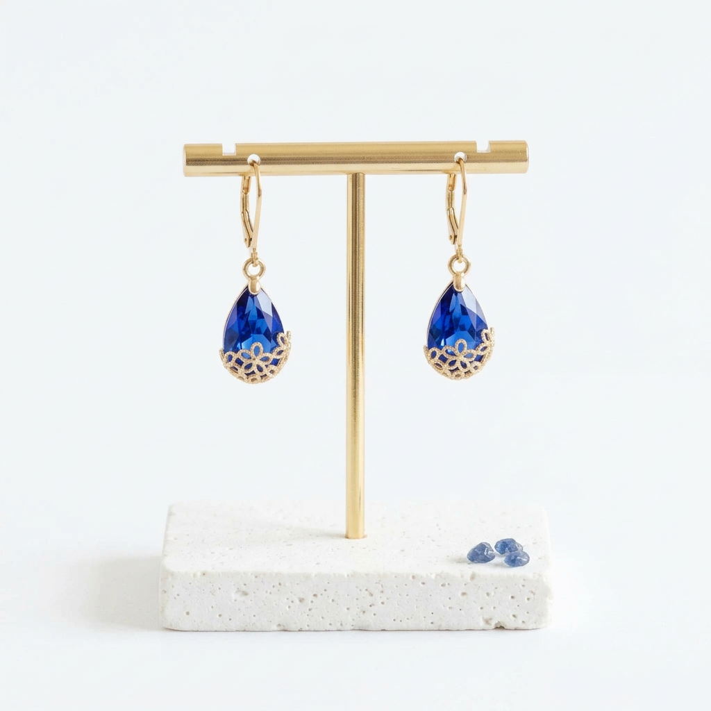 Gold Flower-Cap earrings with Capri blue glass drops, hanging view