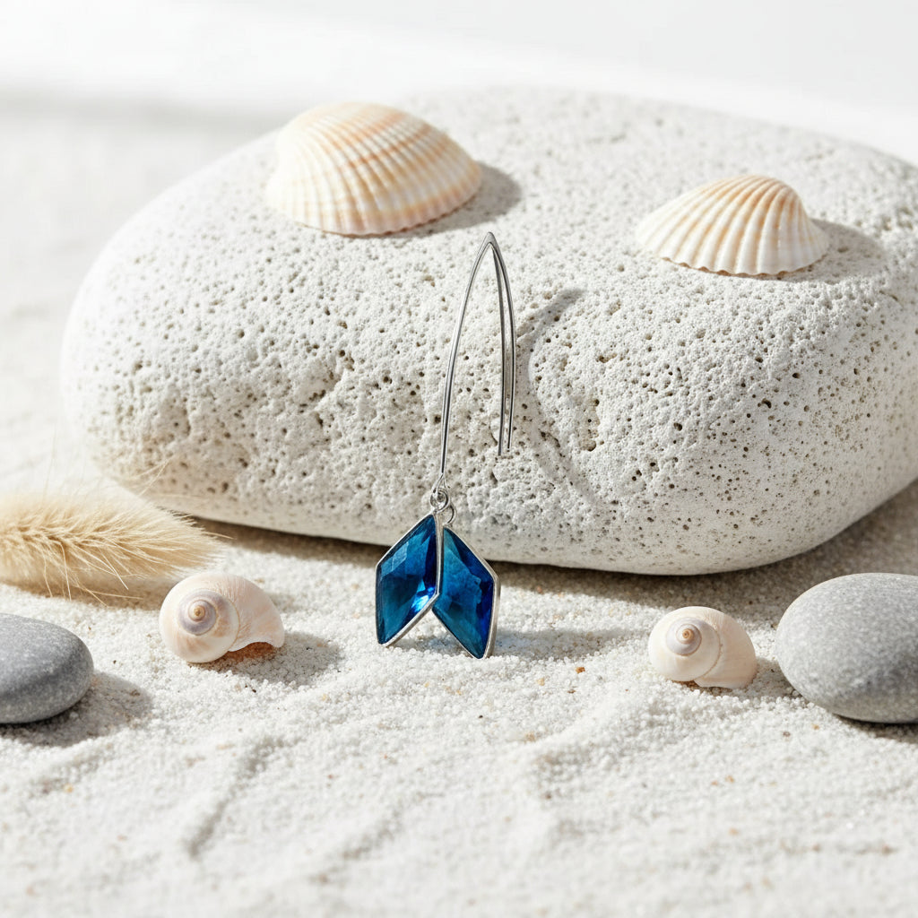 Earring with blue gemstones on a white background