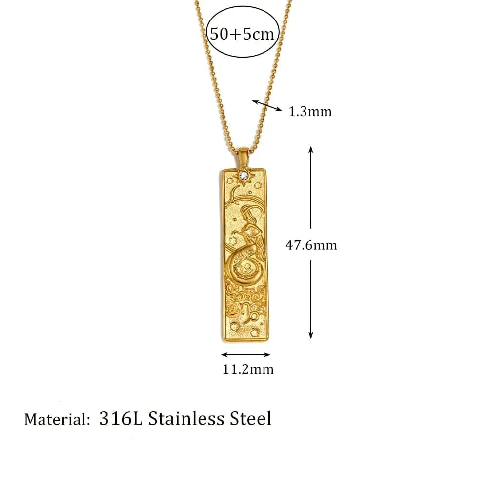 Gold pendant with measurements and details on a white background