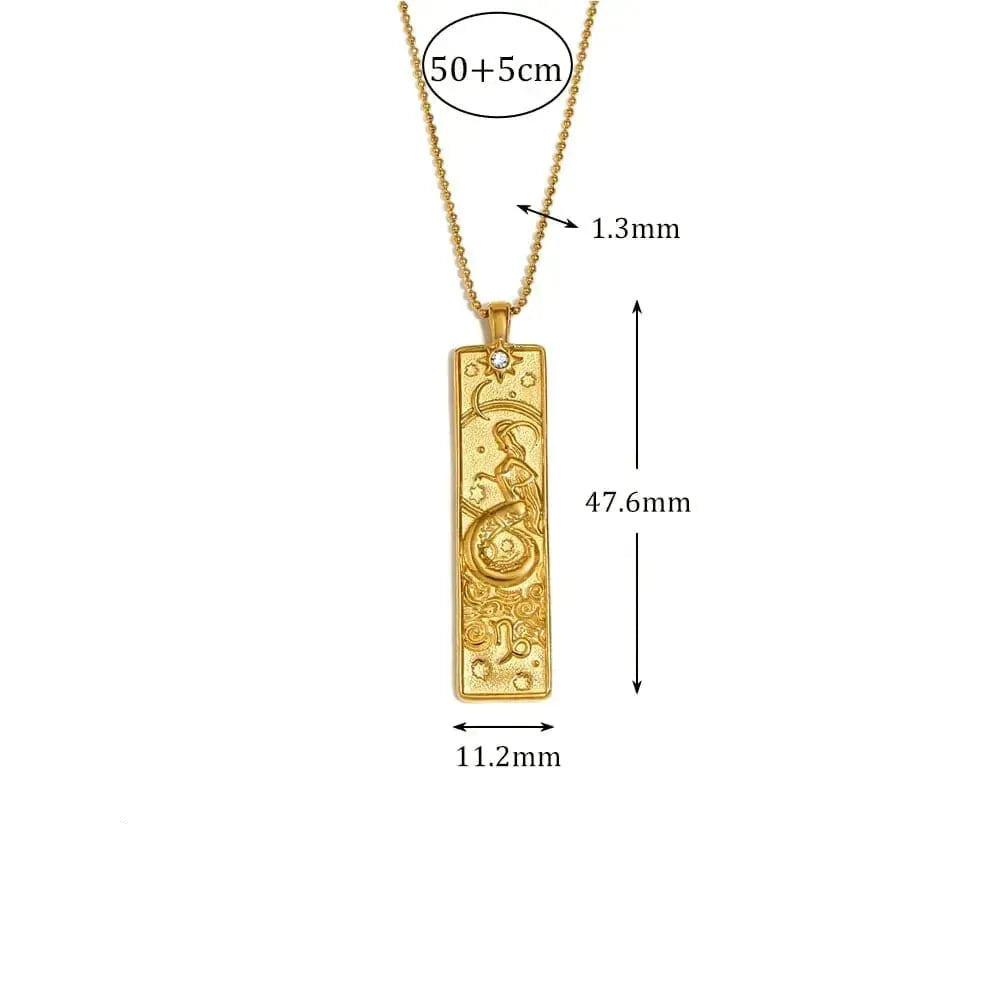 Gold pendant with measurements and details on a white background