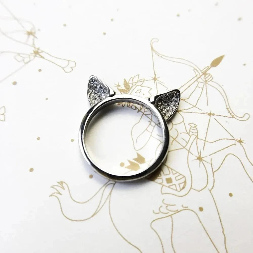 Ring with cat ears on a white background with gold line art