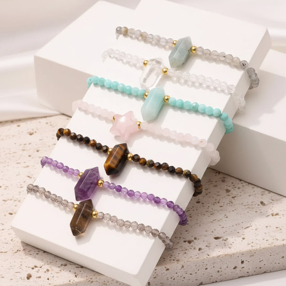 Set of colorful beaded bracelets on a white surface