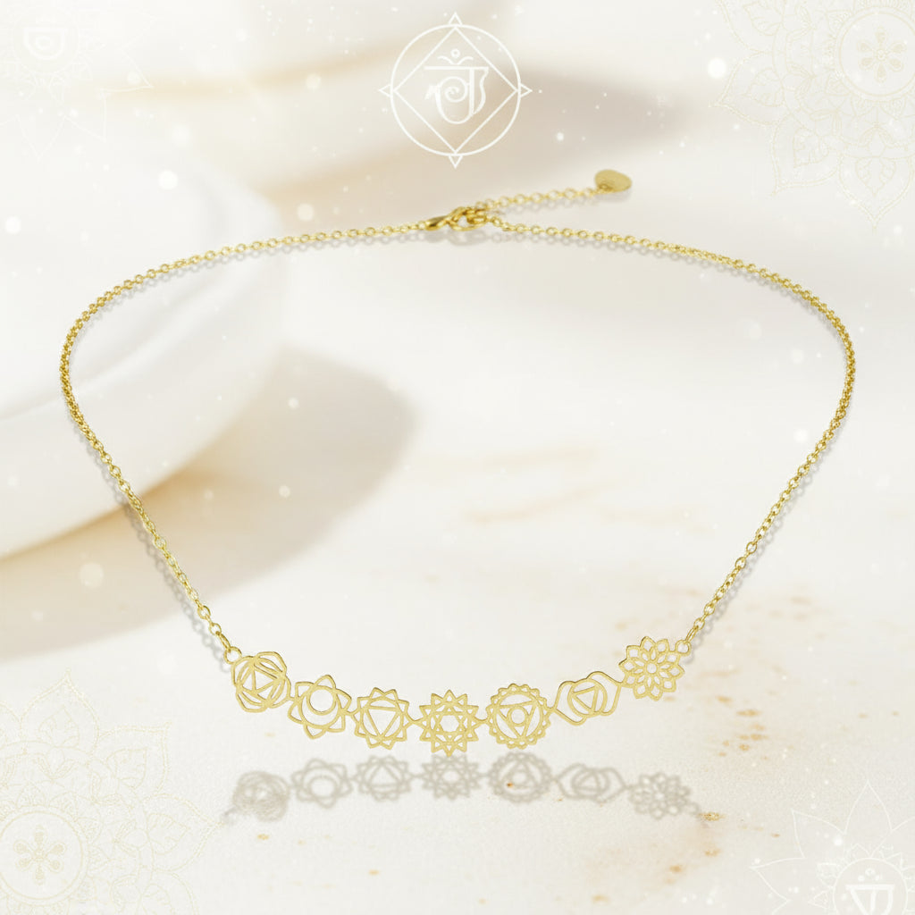 Gold necklace with floral designs on a black background