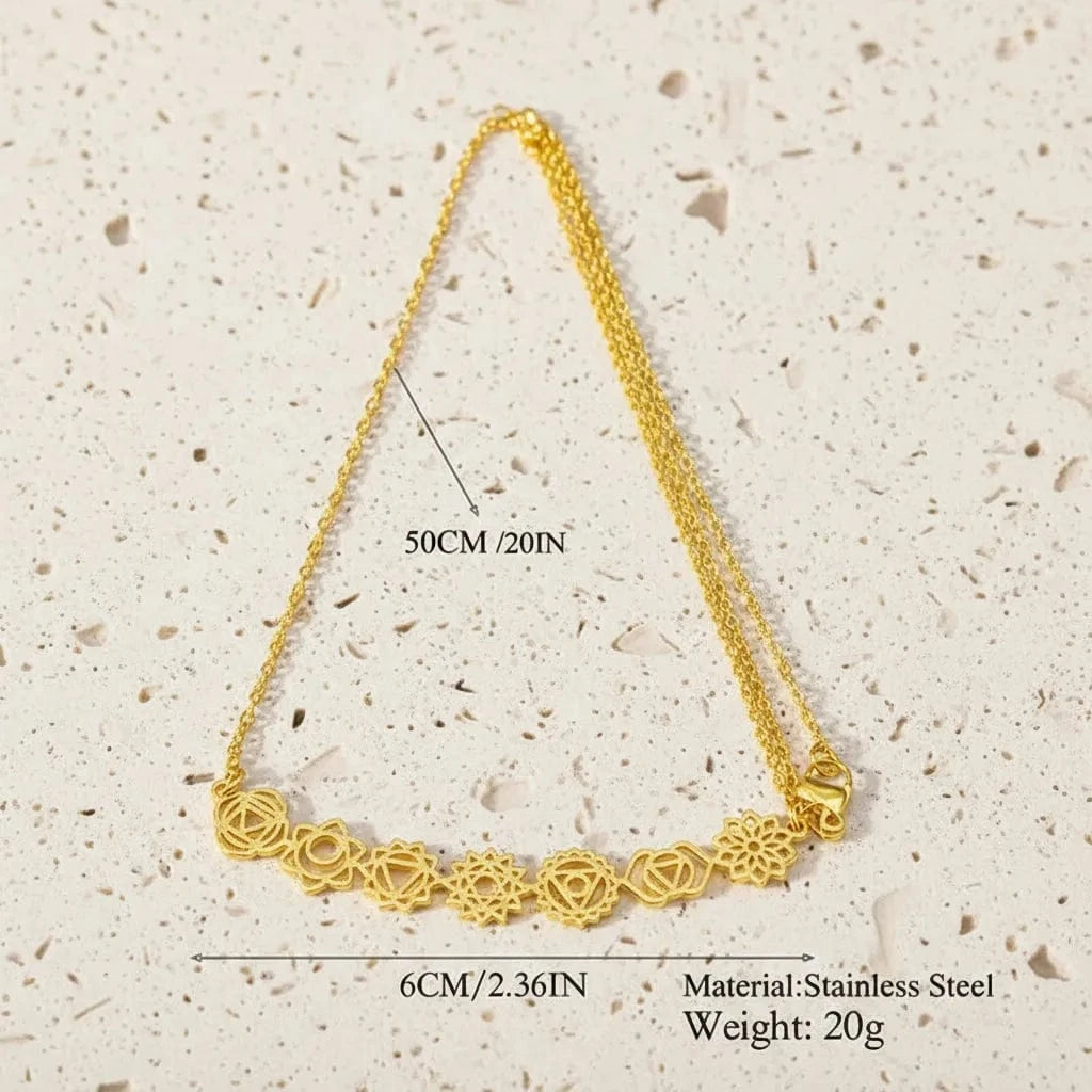 Gold necklace with floral design on a black background