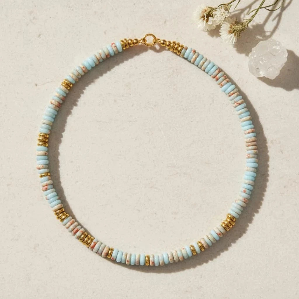 Necklace with multicolored beads on a white background