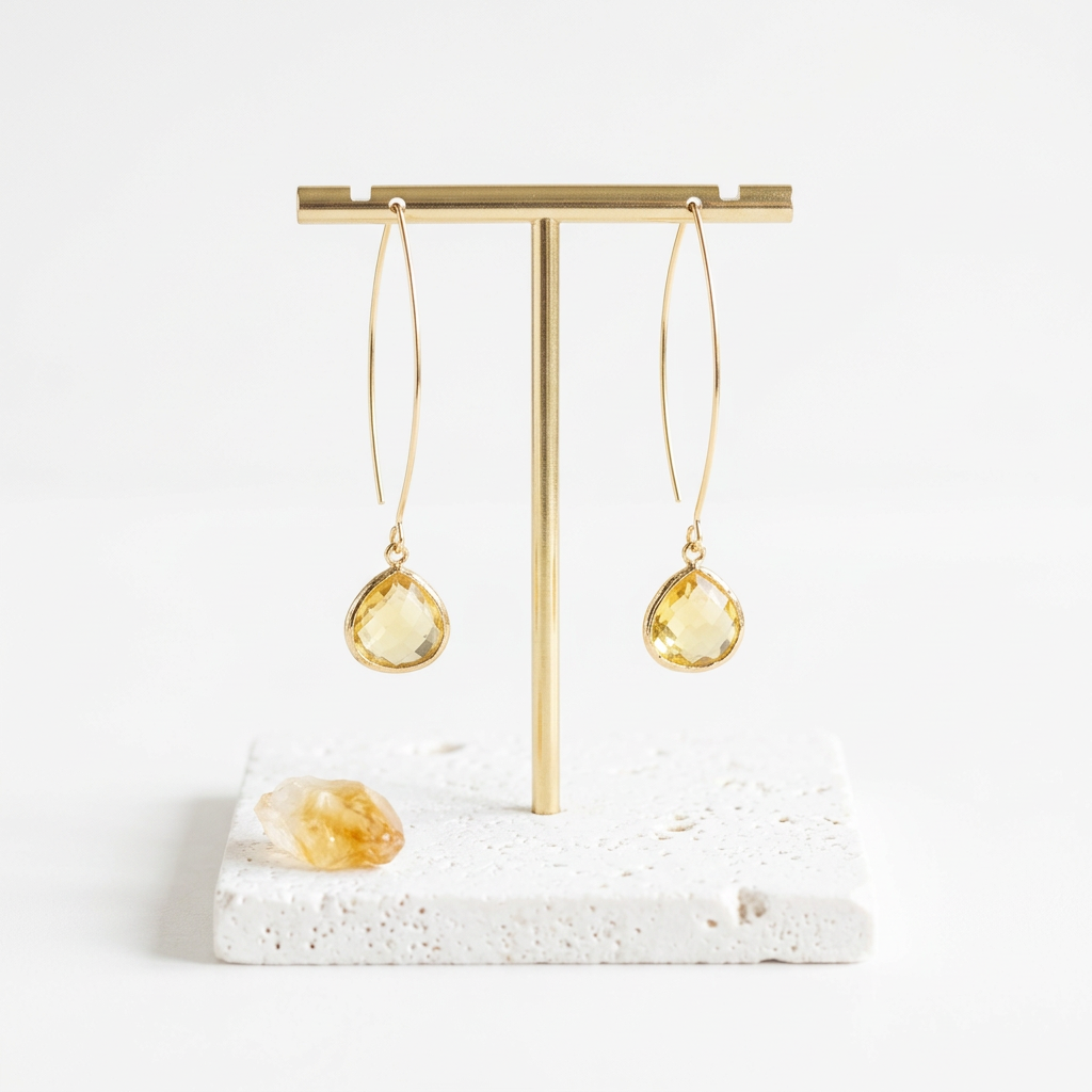 Gold citrine glass pebble earrings on long ear wires, November birthstone colour flat lay