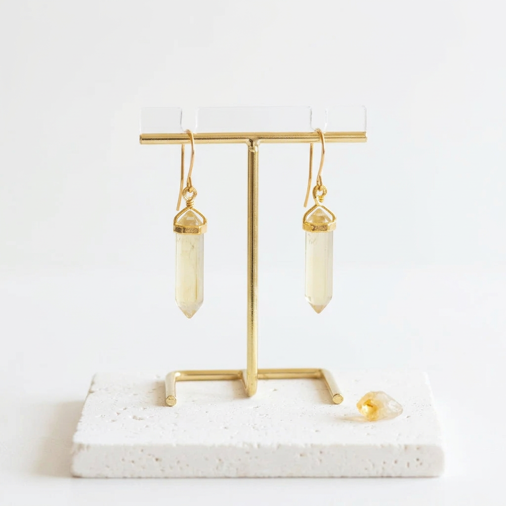 Gold hexagon drop earrings in faux citrine yellow synthetic stone, hanging view