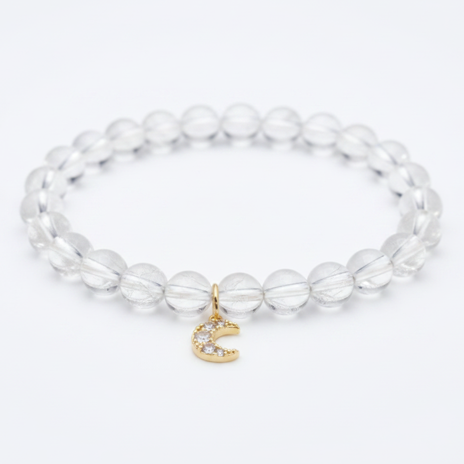 Clear quartz bracelet with a gold crescent moon charm — add-on symbol charm for cycles