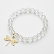 Clear quartz bracelet with a gold dragonfly charm — add-on symbol charm for transformation