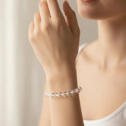 Woman wearing an 8mm clear quartz Crown Chakra bracelet on adjustable cord