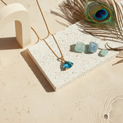Gold Cleo pyramid necklace with Capri blue faceted glass drop
