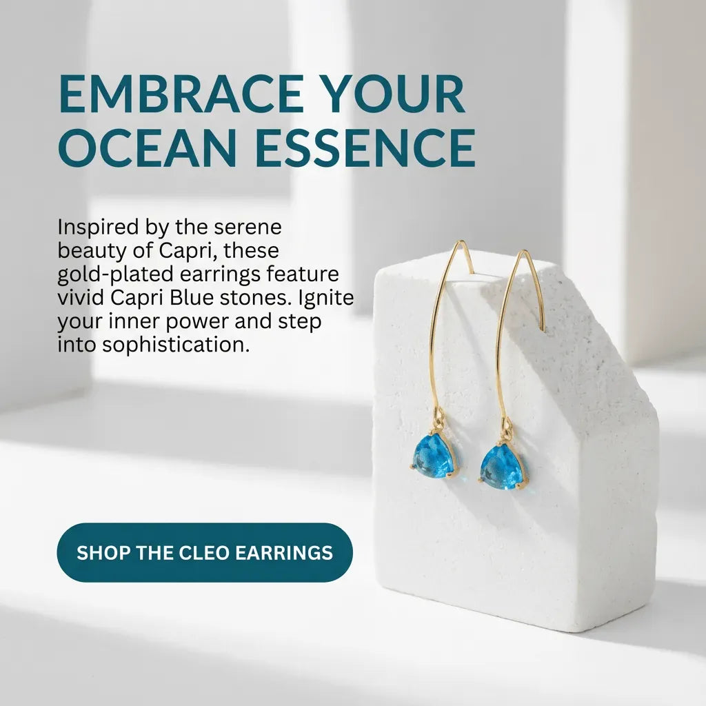 Gold-plated earrings with blue stones on a white stand, text about ocean essence and product details.