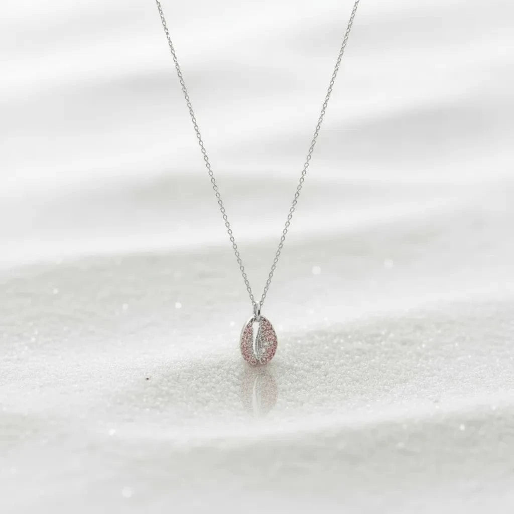 Necklace with a pink pendant on a white background
