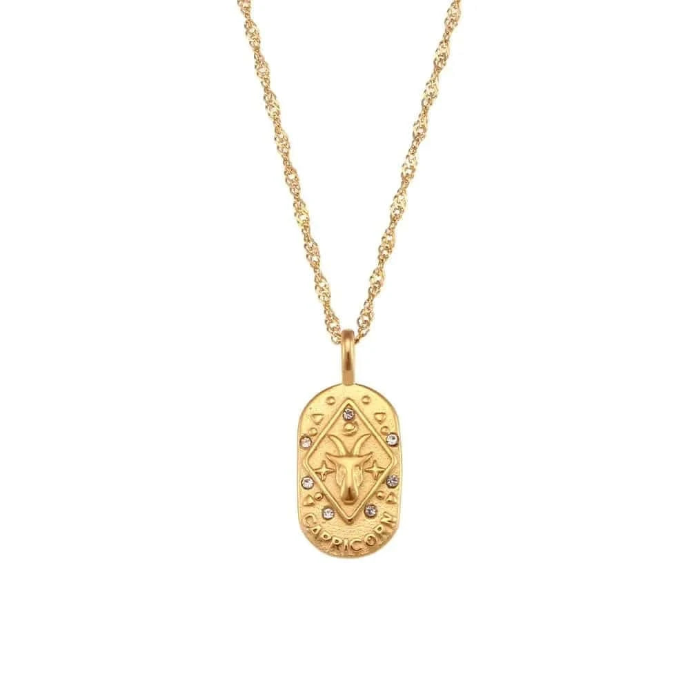 Gold necklace with a decorative pendant on a white background