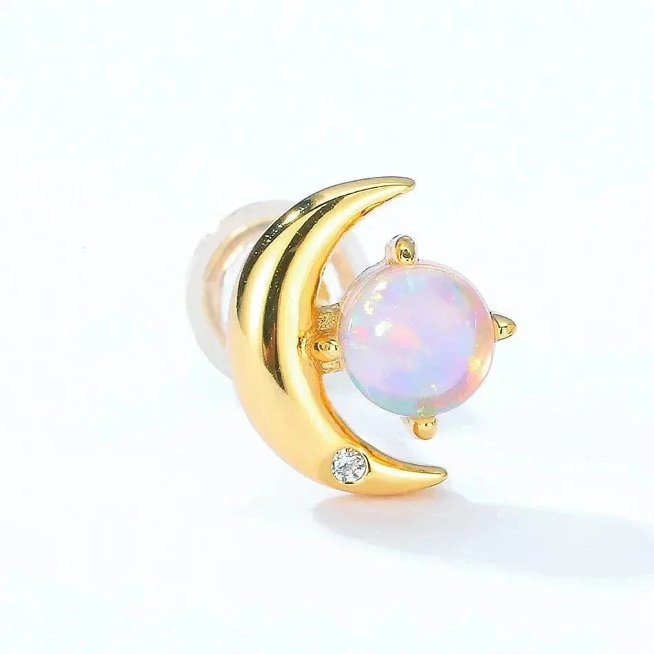 Gold moon-shaped earring with a colorful gemstone on a white background