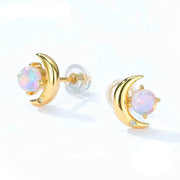 Gold moon-shaped earrings with opal stones on a white background