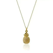 Gold pineapple pendant necklace on a white background