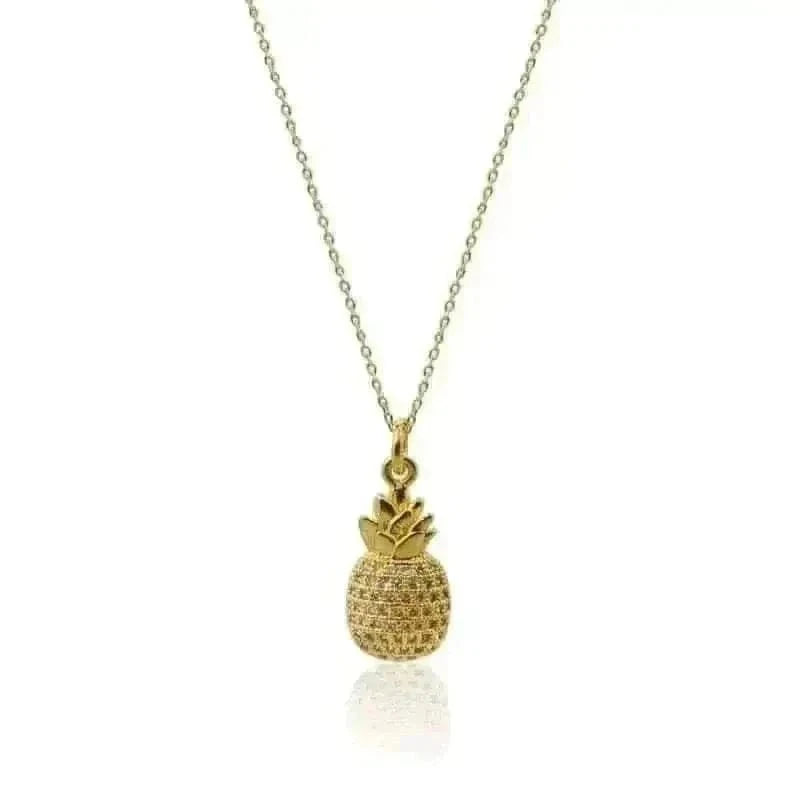 Gold pineapple pendant necklace on a white background