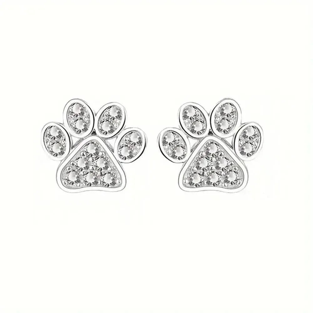 Paw print earrings with clear gemstones on a white background
