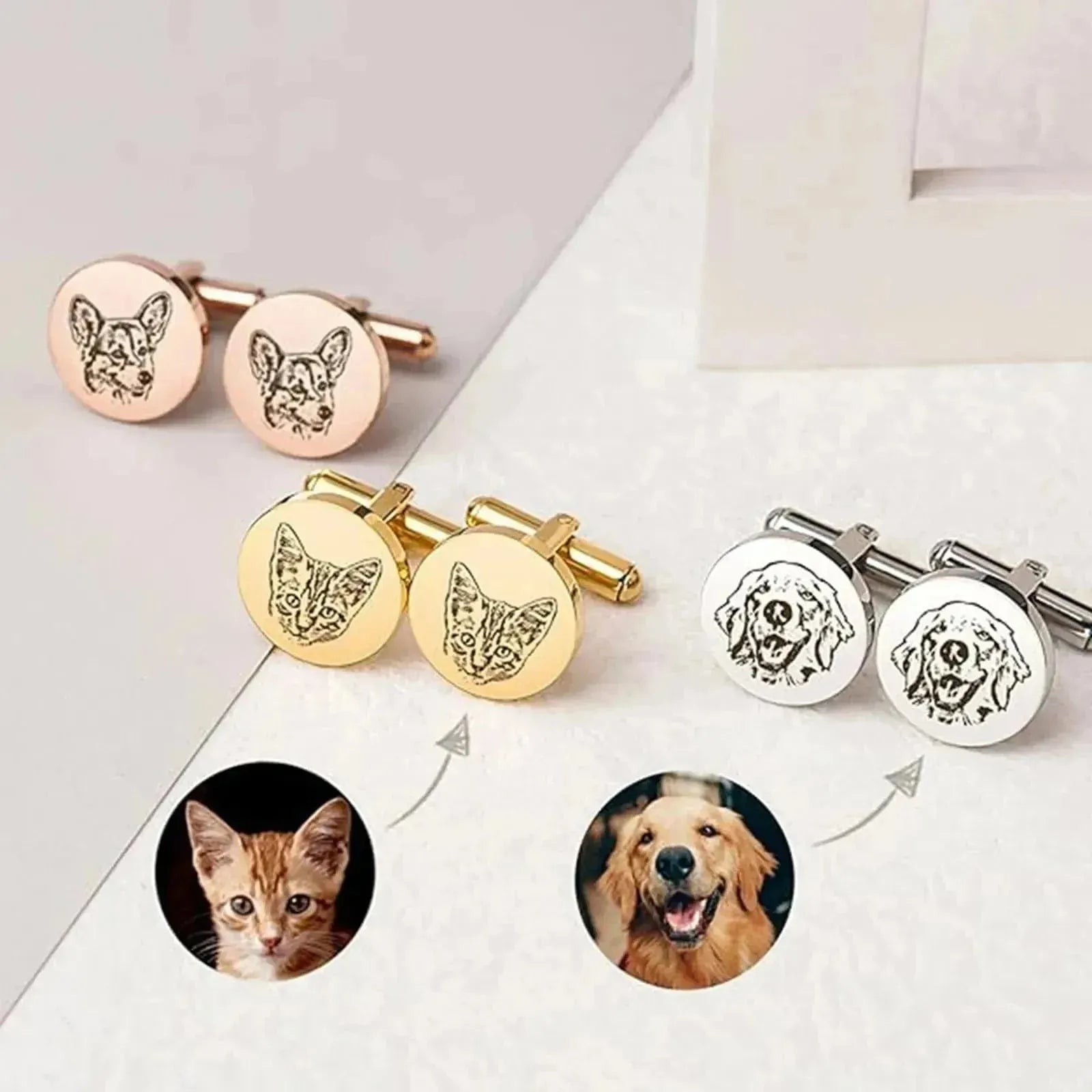 Cufflinks with engraved pet faces on a white surface