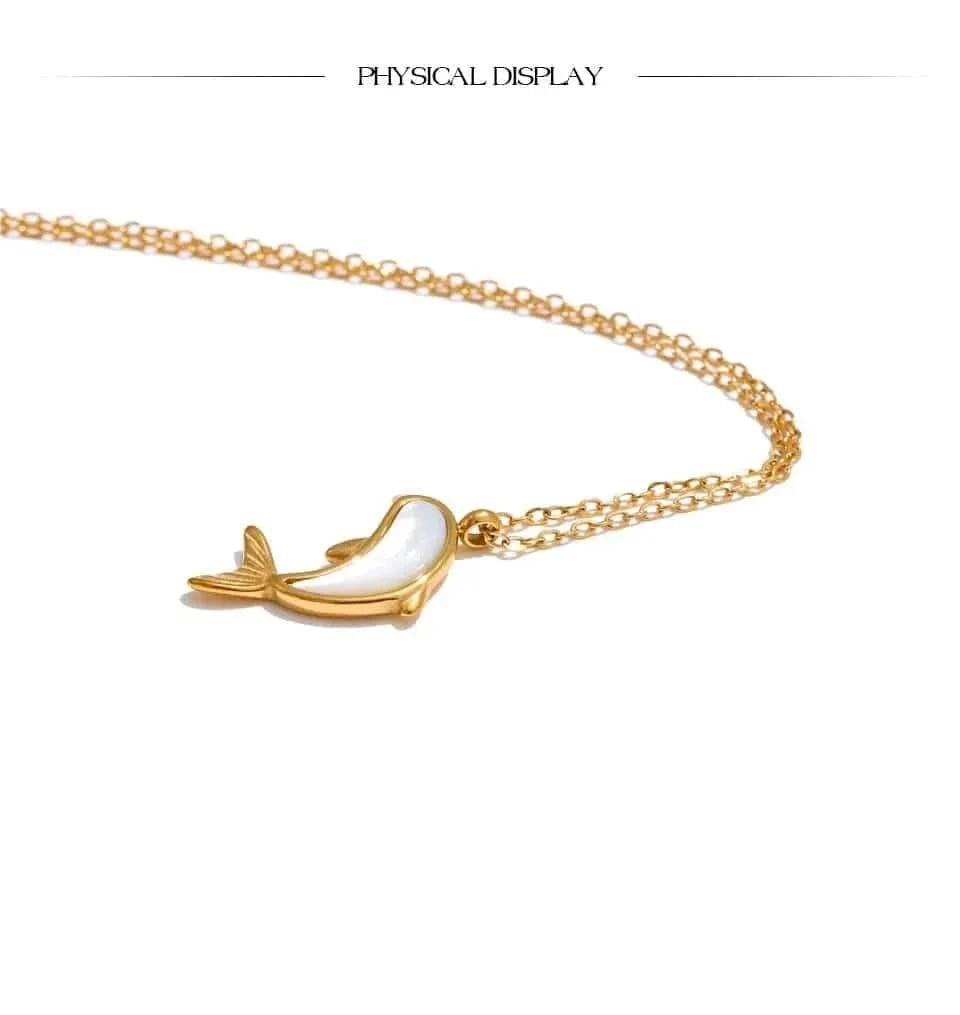 Gold necklace with a dolphin pendant on a white background