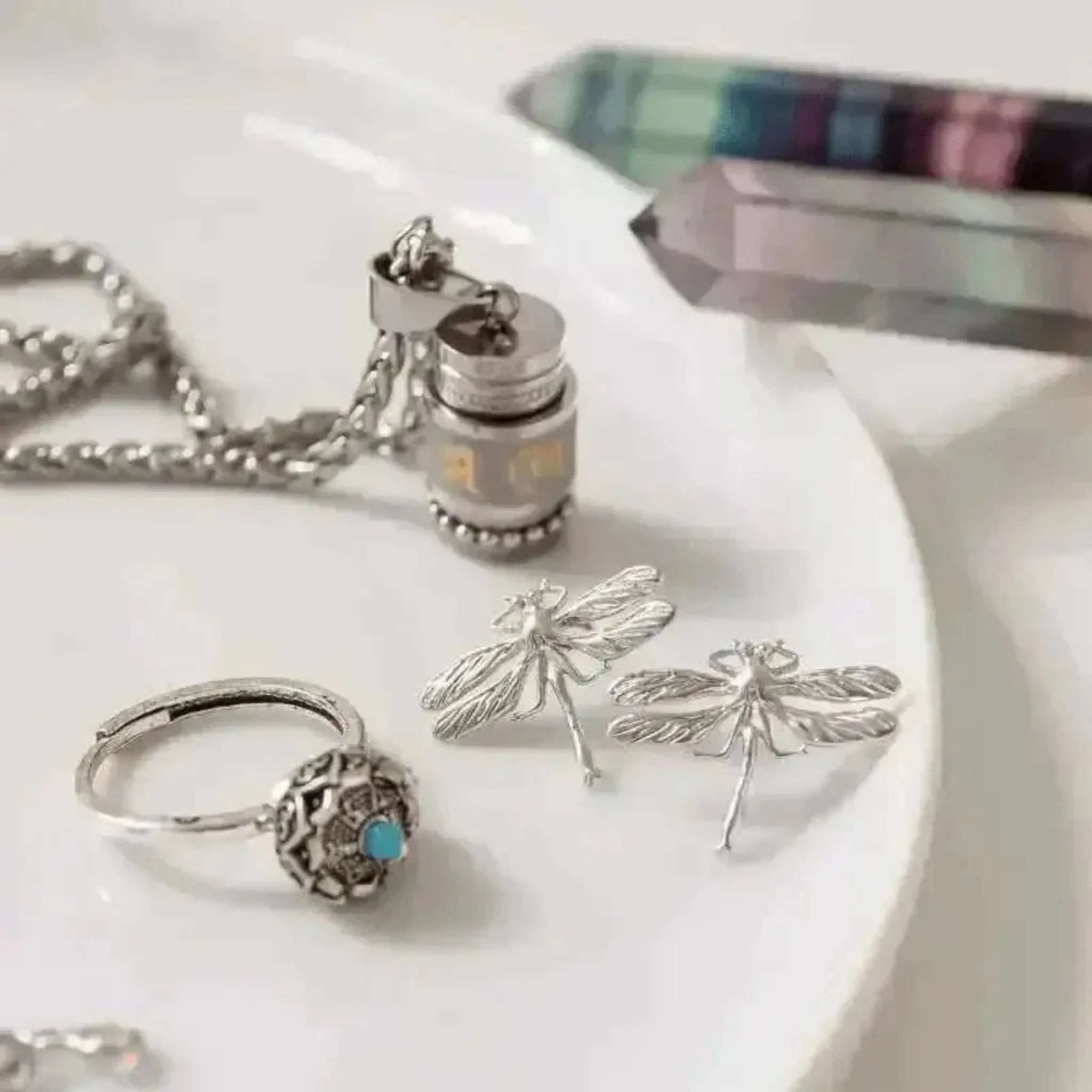 dragonfly stud earrings meditation ring, prayer wheel necklace