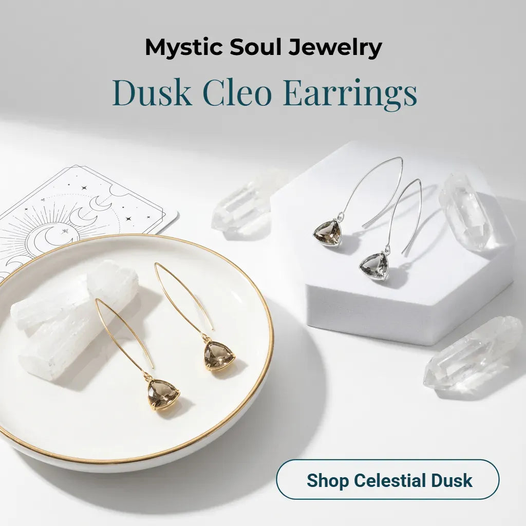 Dusk Cleo earrings from Mystic Soul Jewelry on a white surface with crystals and tarot cards.