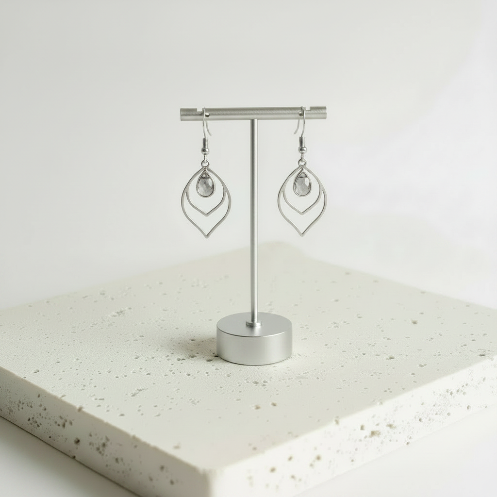 Dusk smoky grey faceted glass teardrop earrings in silver, shown hanging