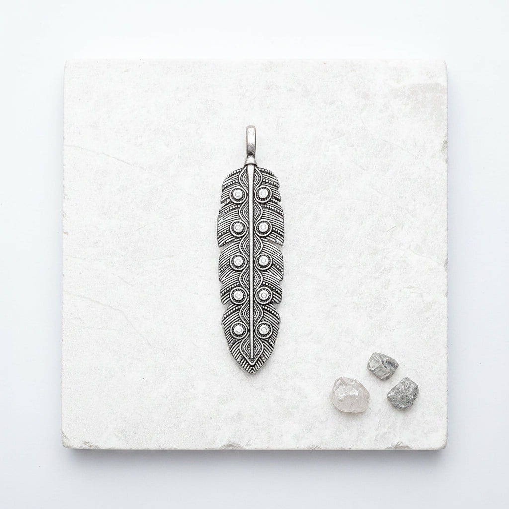 Eagle feather pendant in 925 sterling silver with zircon — statement jewellery for perspective