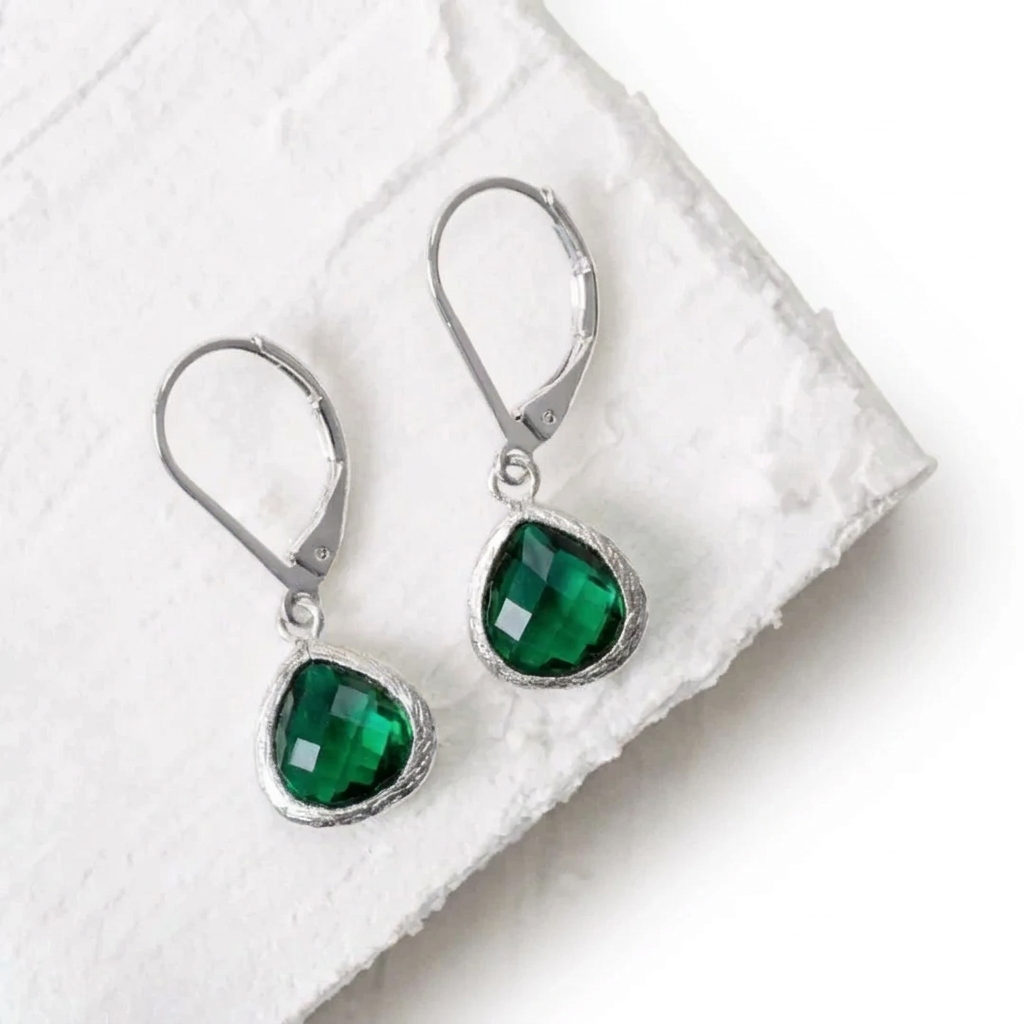 Silver Petite Pebble leverback earrings in emerald green faceted glass, May birthstone colour