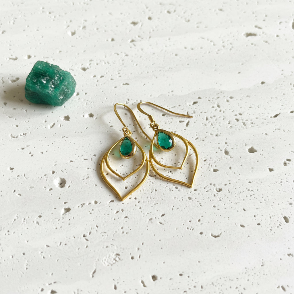 Emerald green faceted glass teardrop earrings, close detail