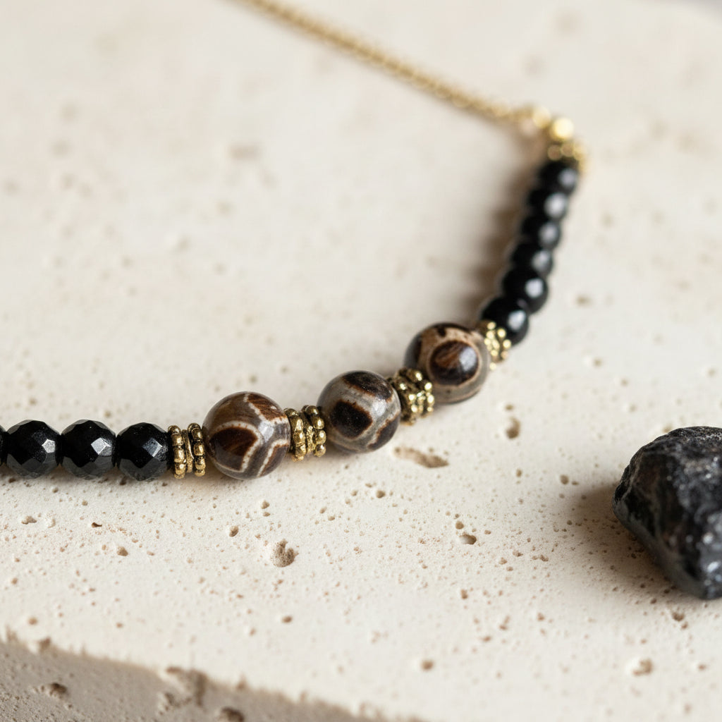 Reticulated etched agate bead close up — dzi-style necklace jewelry for grounding