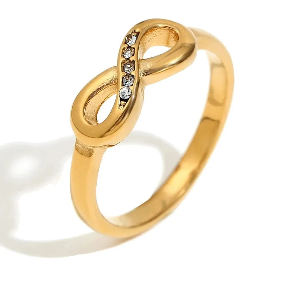 Gold ring with diamonds on a white background,