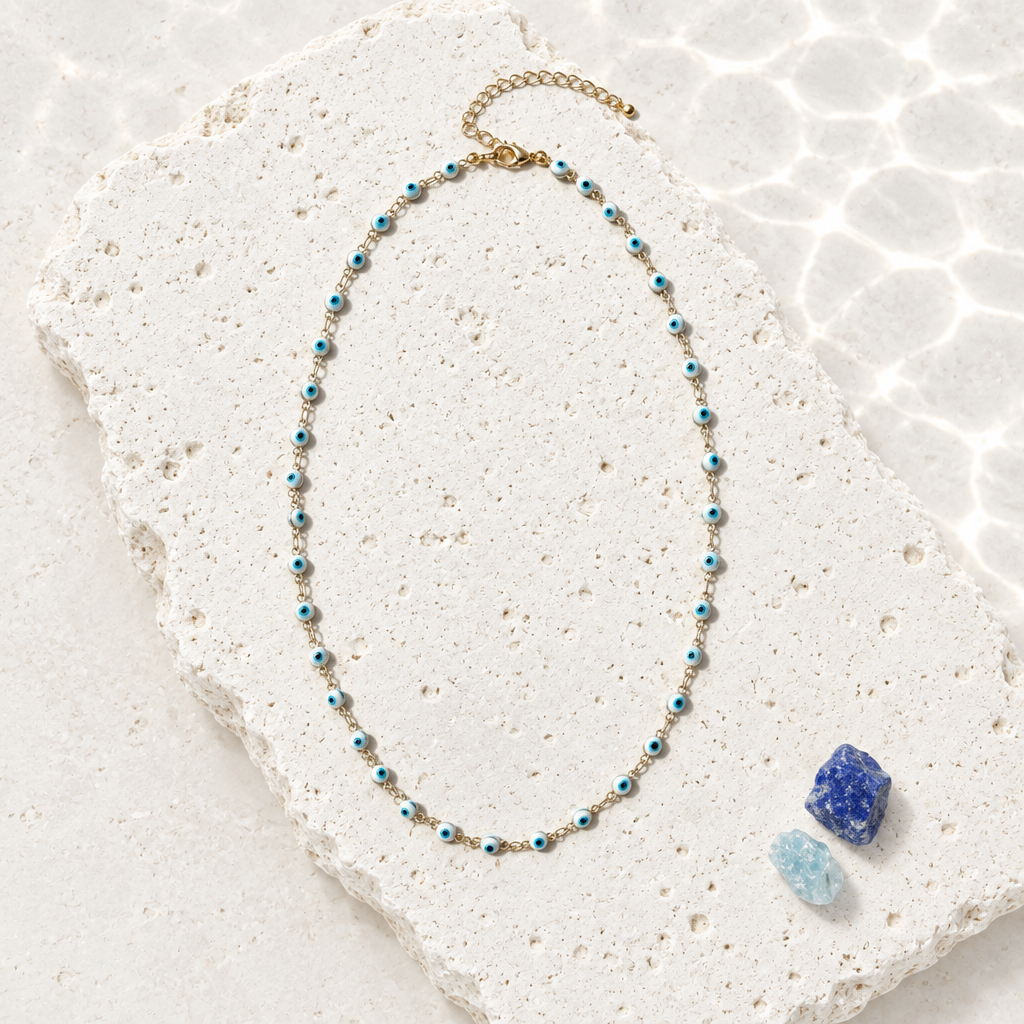 White and blue evil eye bead chain necklace in gold plate, shown in full with the clasp