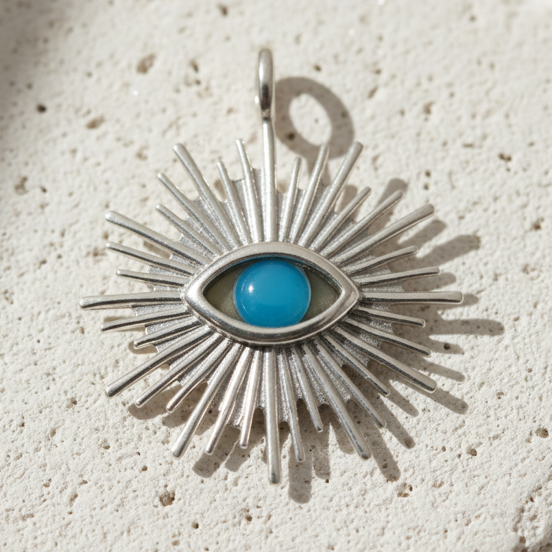 Silver plated evil eye charm with a turquoise centre — symbol of protection
