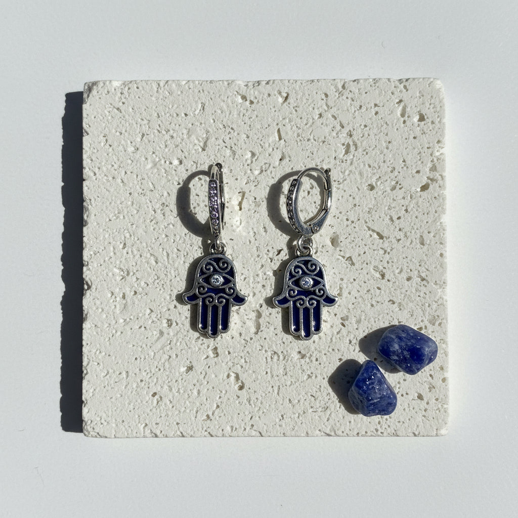 Sterling silver hamsa leverback earrings in blue enamel with a clear crystal eye