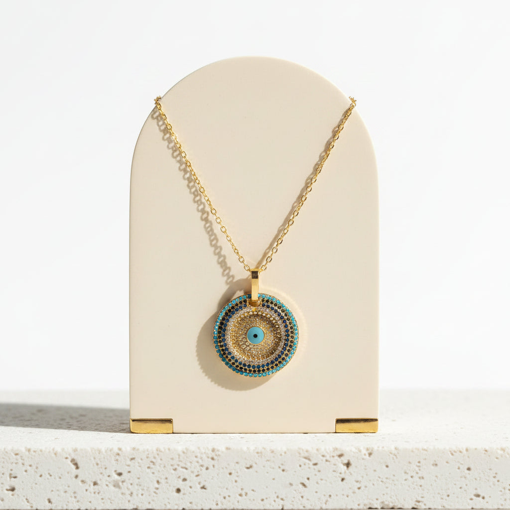 Pave blue and gold evil eye pendant necklace hanging — protection talisman jewelry
