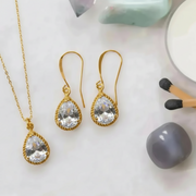 Clear exquisite necklace and earring set in gold, April birthstone jewelry