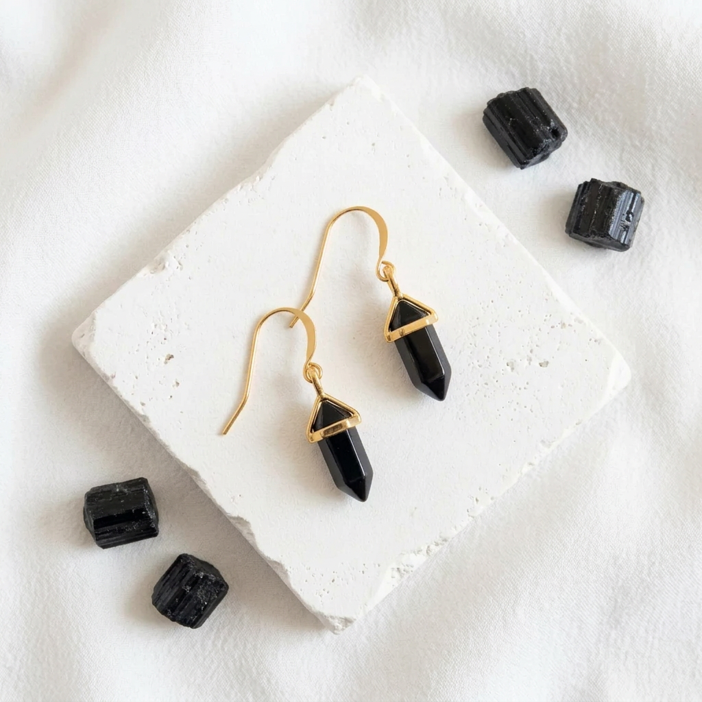Gold hexagon drop earrings in faux onyx black synthetic stone