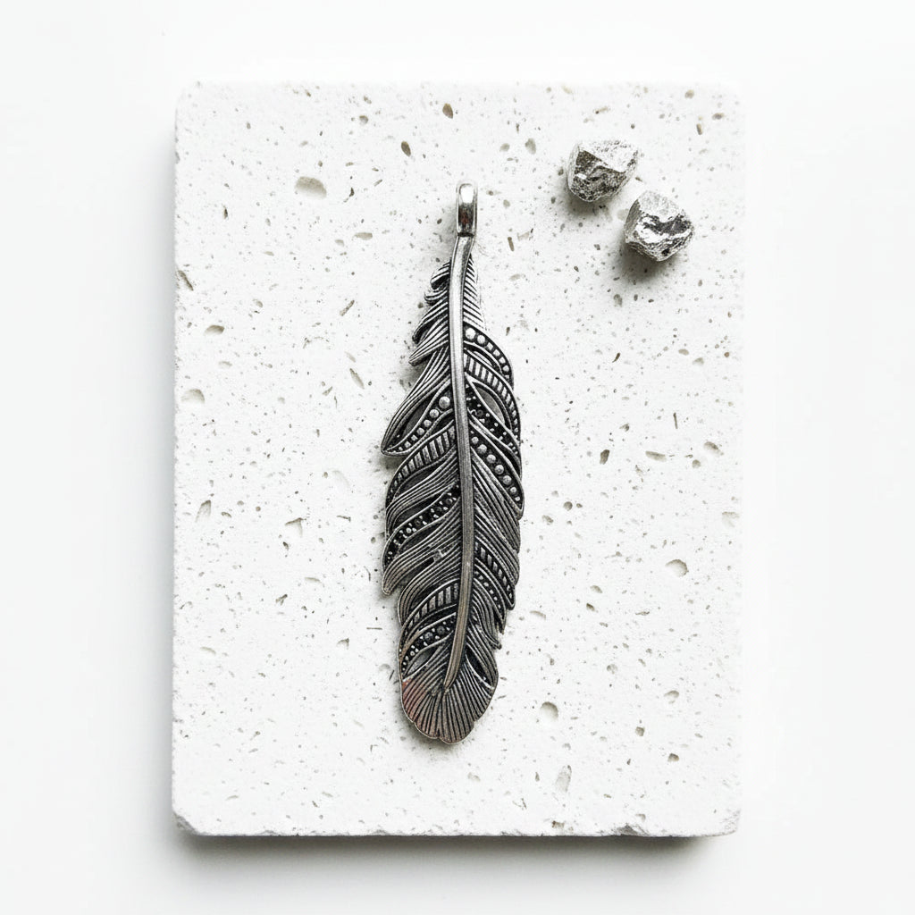 Black feather pendant in blackened 925 sterling silver — air element jewellery for transformation
